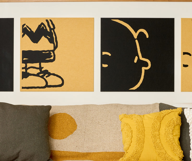 close up of Charlie Brown felt tiles on wall