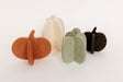 Set of four felt pumpkins in different colors on a white background