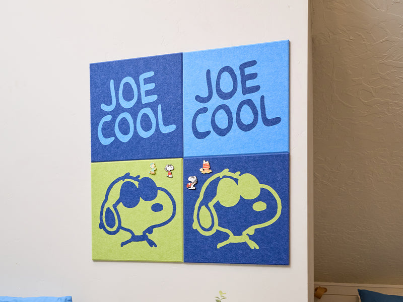 Two blue and green panels with 'Joe Cool' text and Snoopy illustrations on a white wall.
