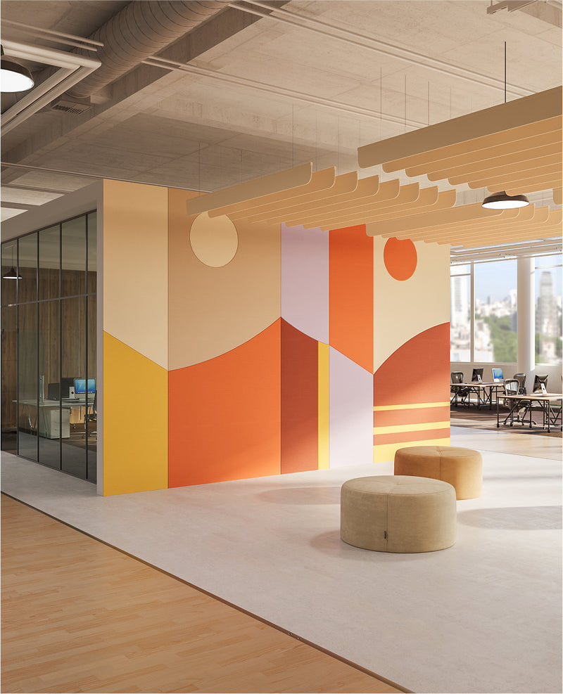 Modern office interior with colorful geometric wall design and wooden flooring.