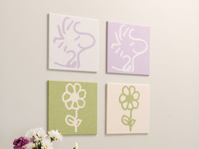 4 pastel panels with Woodstock illustrations on the wall.