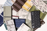 Collection of fabric swatches featuring striped, floral, and geometric patterns in various colors including blue, brown, yell
