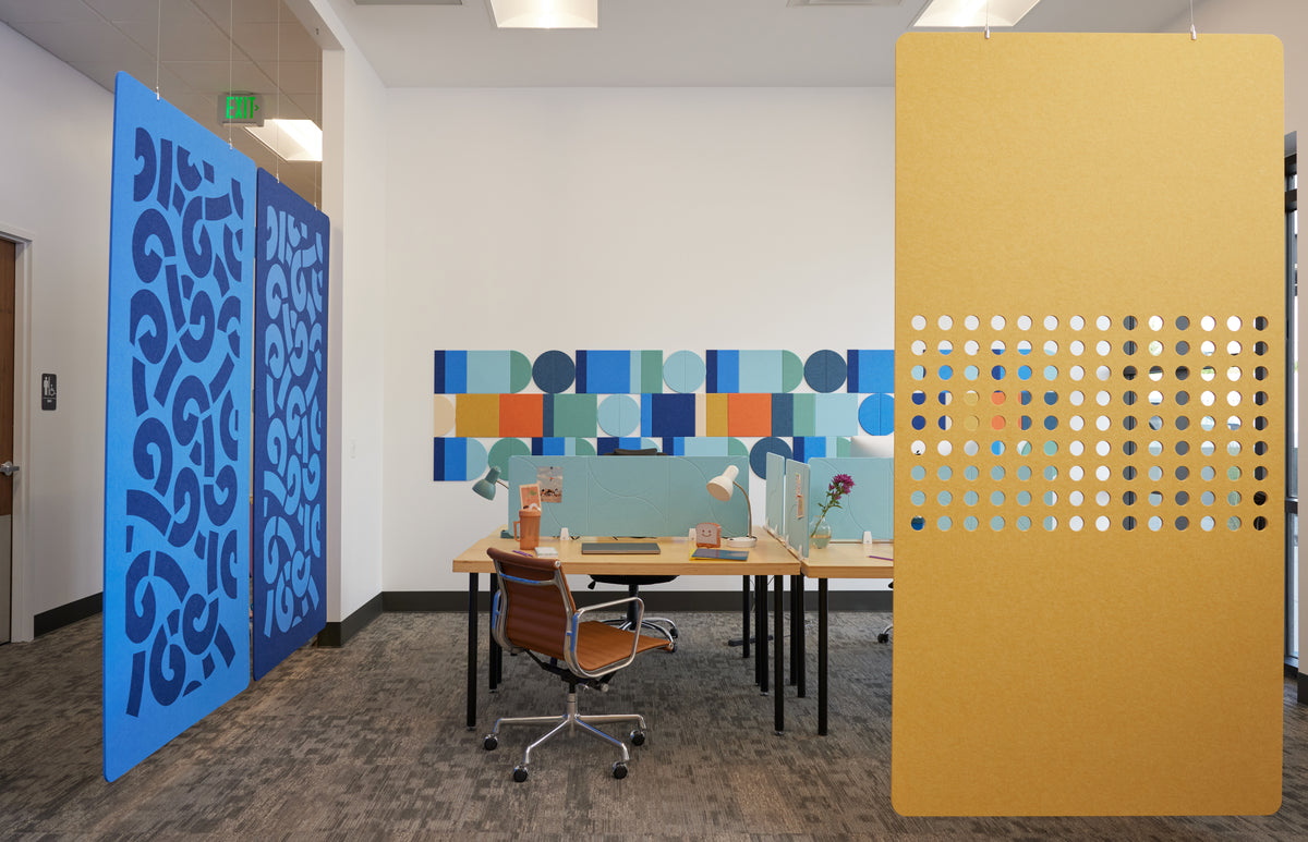 Decorative wall panels in a modern office setting with a desk and chair.