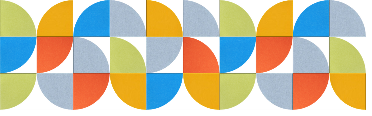 Geometric wall design with repeating pattern of colored quarter-circle sections in yellow, orange, blue, and gray.