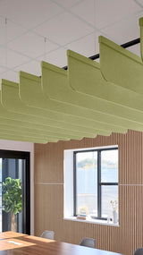 Light green acoustic ceiling blade baffles suspended from the ceiling, installed in a conference room. Felt Right's acoustic blade baffles absorb 65% of sound waves, making office spaces quieter and feel more calm.