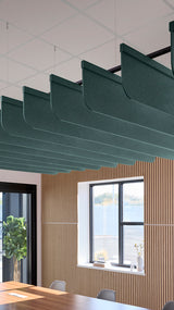 Blue-green acoustic ceiling blade baffles suspended from the ceiling, installed in a conference room. Felt Right's acoustic blade baffles absorb 65% of sound waves, making office spaces quieter and feel more calm.
