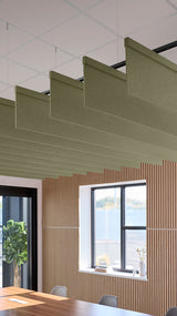 Green acoustic ceiling blade baffles suspended from the ceiling, installed in a conference room. Felt Right's acoustic blade baffles absorb 65% of sound waves, making office spaces quieter and feel more calm.