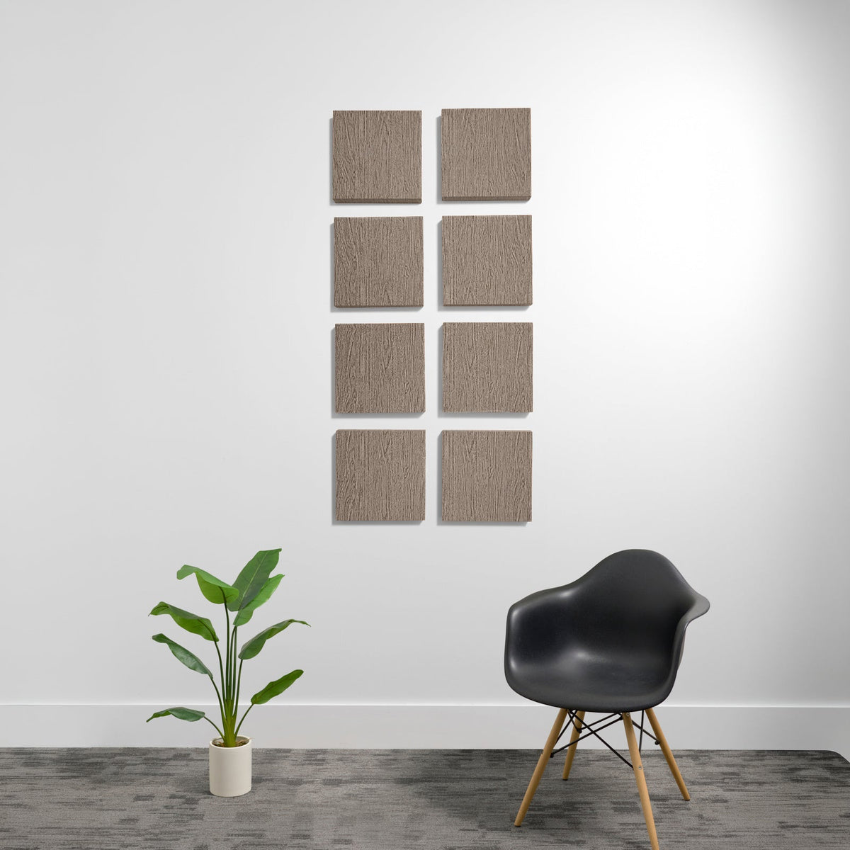 Eight tan textured acoustic panels arranged in a 2x4 grid on a white wall.