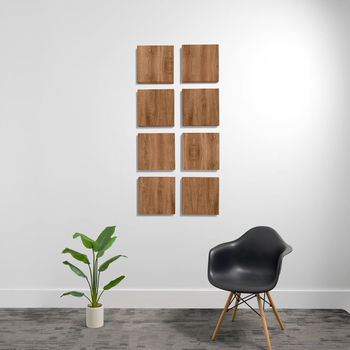 Eight wood-grain acoustic panels arranged in a 2x4 grid on a white wall above a black chair and potted plant.