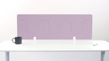 Lavender desk divider with wave-shaped cutouts mounted on white desk with black mug and papers.