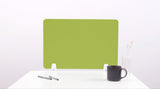 Lime green desk divider with rounded corners mounted on white desk base, positioned behind coffee mug and pens.