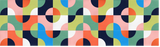 Colorful geometric wall design with repeating pattern of quarter-circle shapes in navy, coral, yellow, teal, white, and pink.