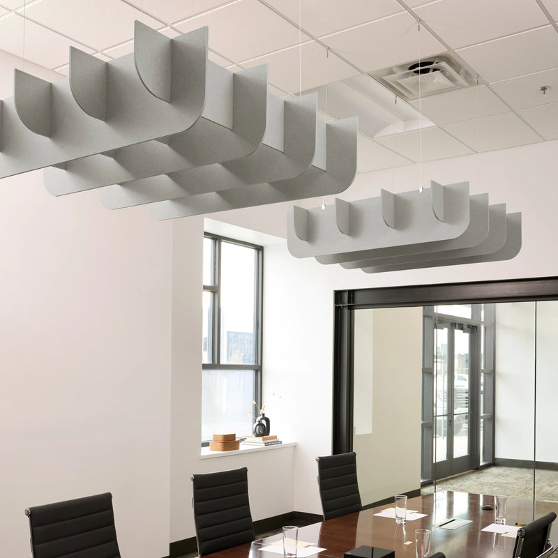 Fin 3D Cloud acoustic ceiling baffles in Fog felt above a conference table