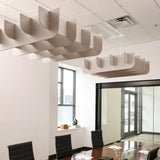 Fin 3D Cloud acoustic ceiling baffles in Latte felt above a conference table
