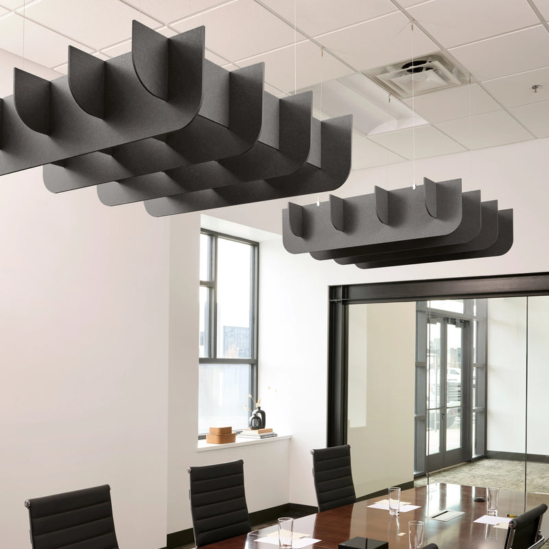 Fin 3D Cloud acoustic ceiling baffles in Mineral felt above a conference table