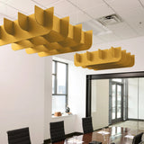 Fin 3D Cloud acoustic ceiling baffles in Mustard felt above a conference table