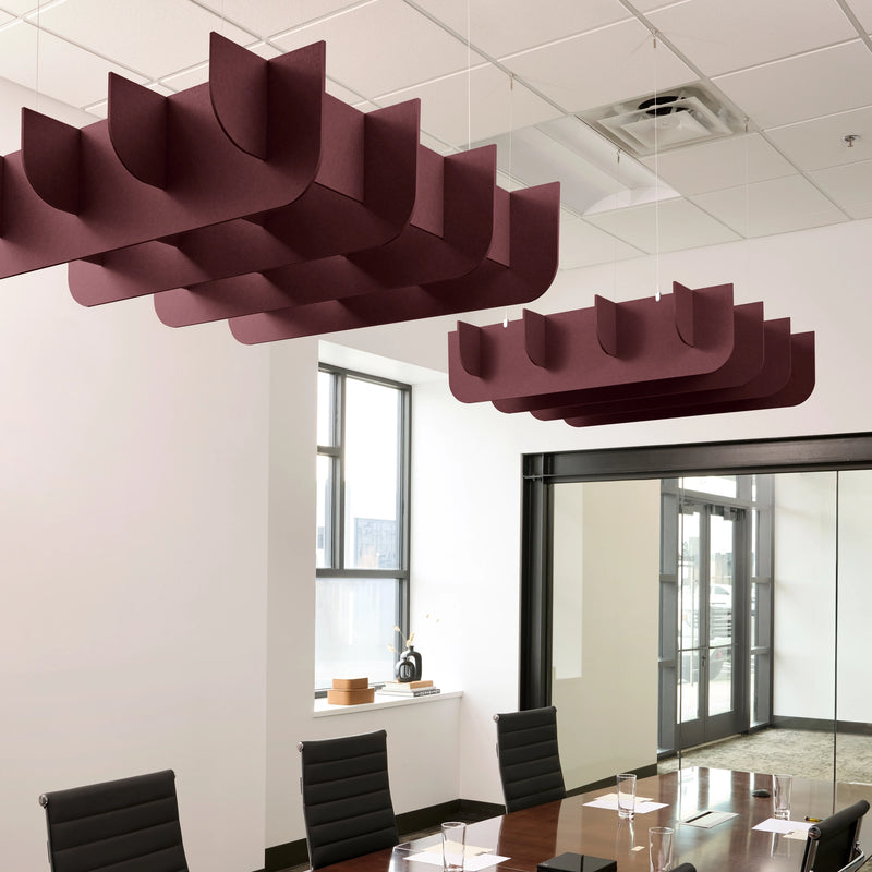 Fin 3D Cloud acoustic ceiling baffles in Wine felt above a conference table