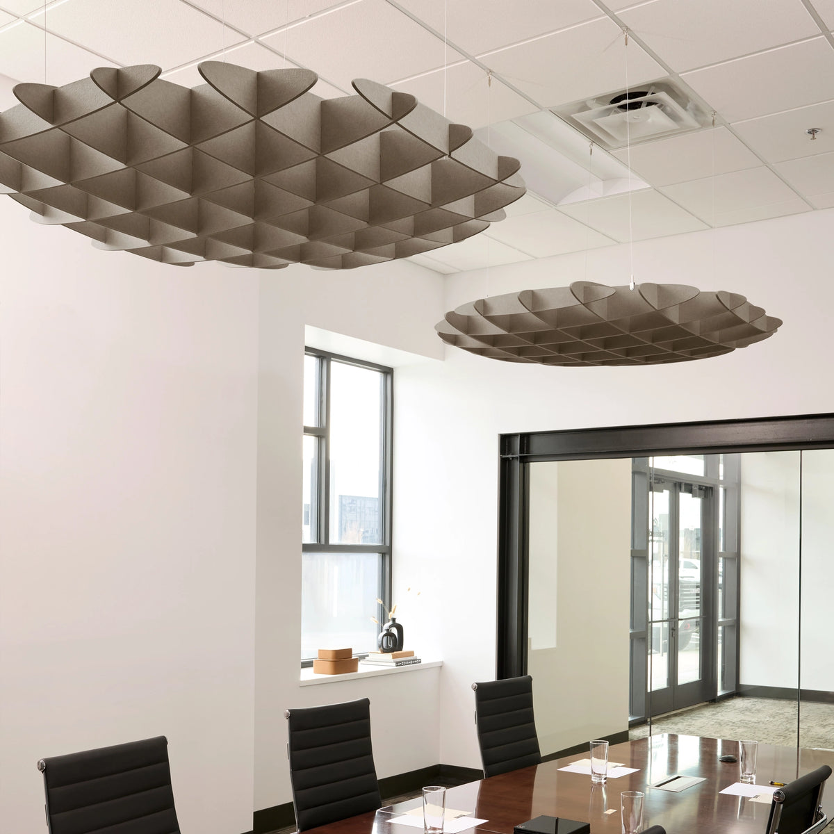 Foil 3D Cloud acoustic ceiling baffles in Ash felt above a conference table