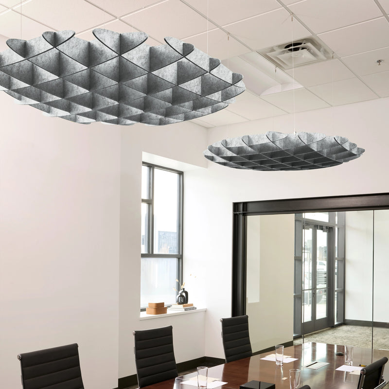 Foil 3D Cloud acoustic ceiling baffles in Nickel felt above a conference table