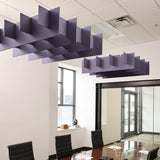 Grid 3D Cloud acoustic ceiling baffles in Wisteria felt above a conference table