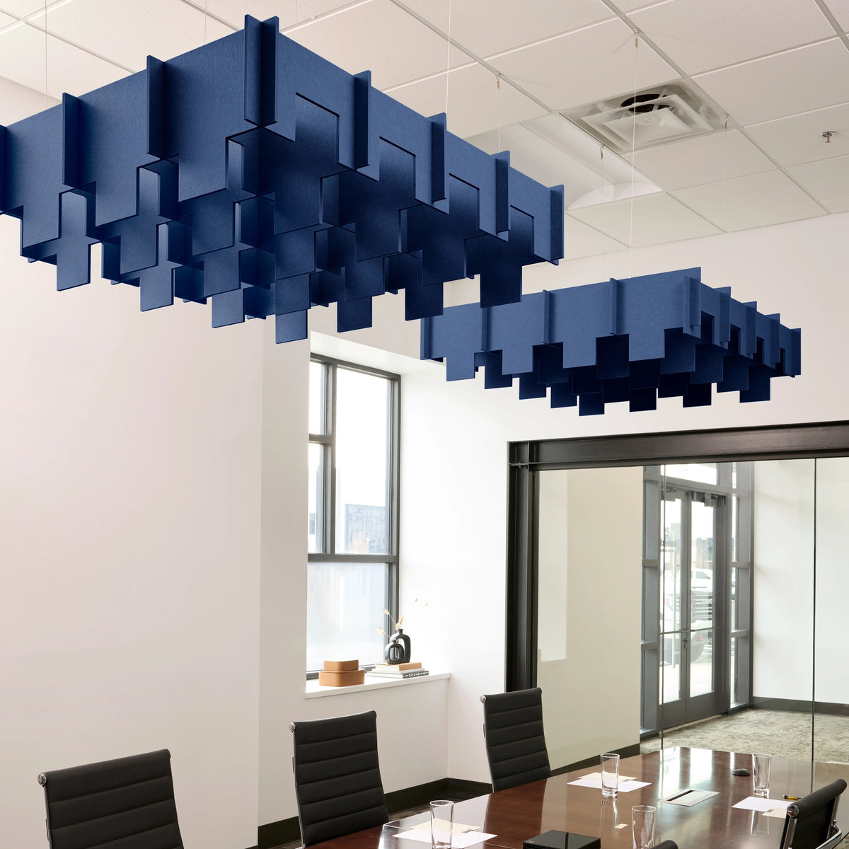 Drop 3D Cloud acoustic ceiling baffles in Admiral felt above a conference table