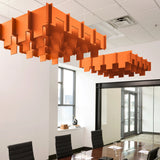 Drop 3D Cloud acoustic ceiling baffles in Aries felt above a conference table