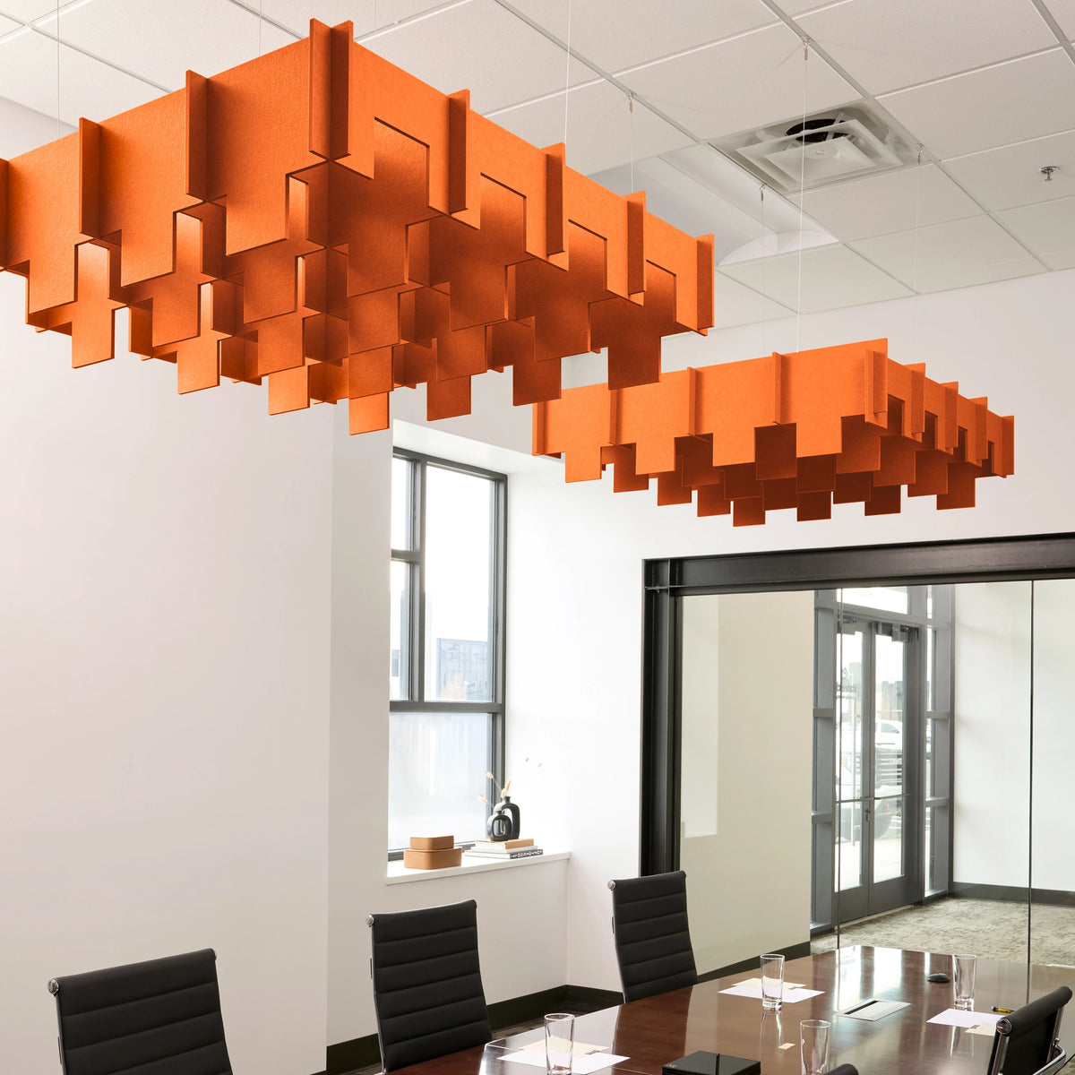 Drop 3D Cloud acoustic ceiling baffles in Aries felt above a conference table