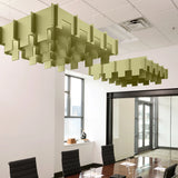 Drop 3D Cloud acoustic ceiling baffles in Aloe felt above a conference table