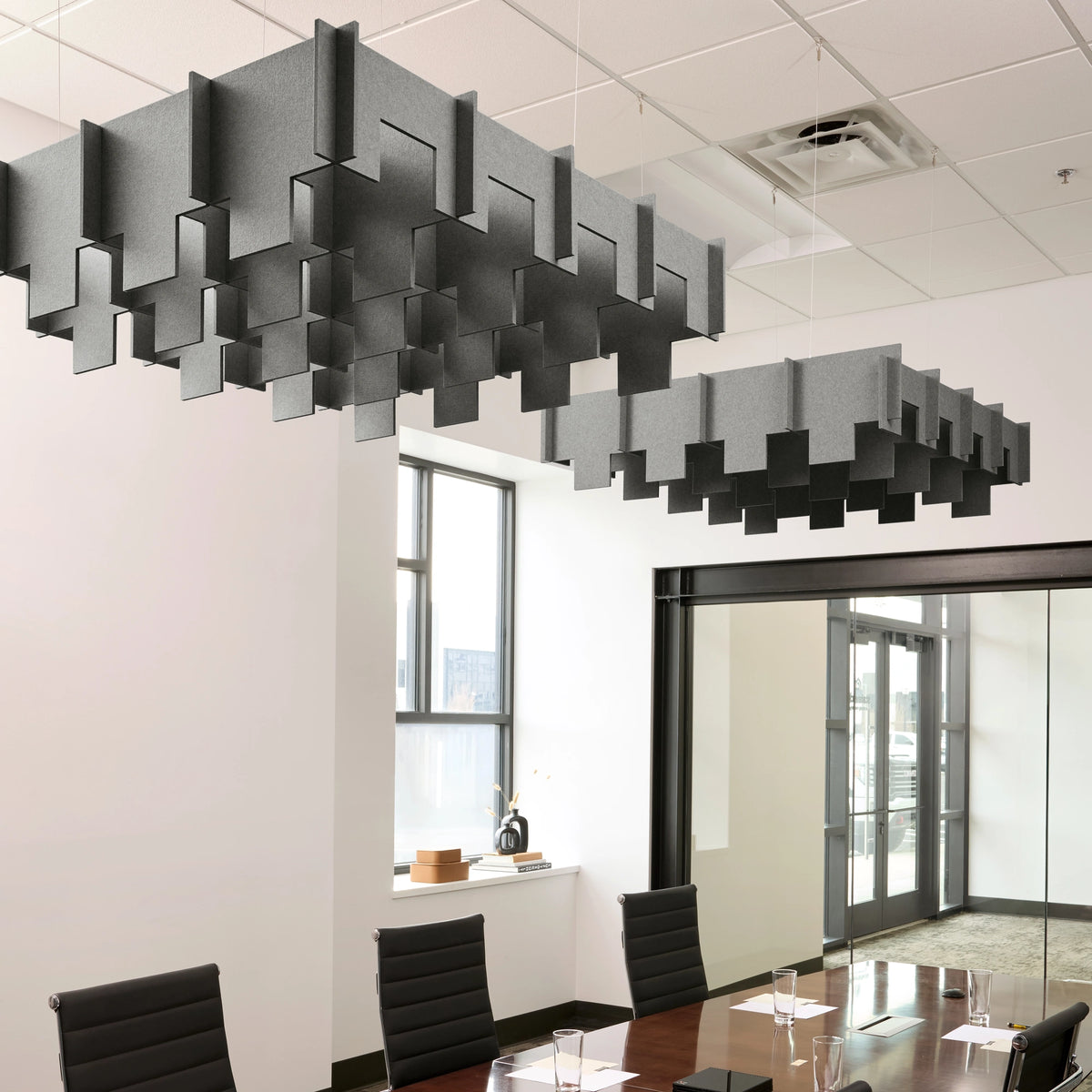 Drop 3D Cloud acoustic ceiling baffles in Armor felt above a conference table