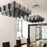Drop 3D Cloud acoustic ceiling baffles in Armor felt above a conference table