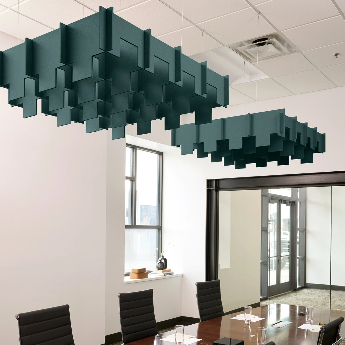 Drop 3D Cloud acoustic ceiling baffles in Atlantic felt above a conference table