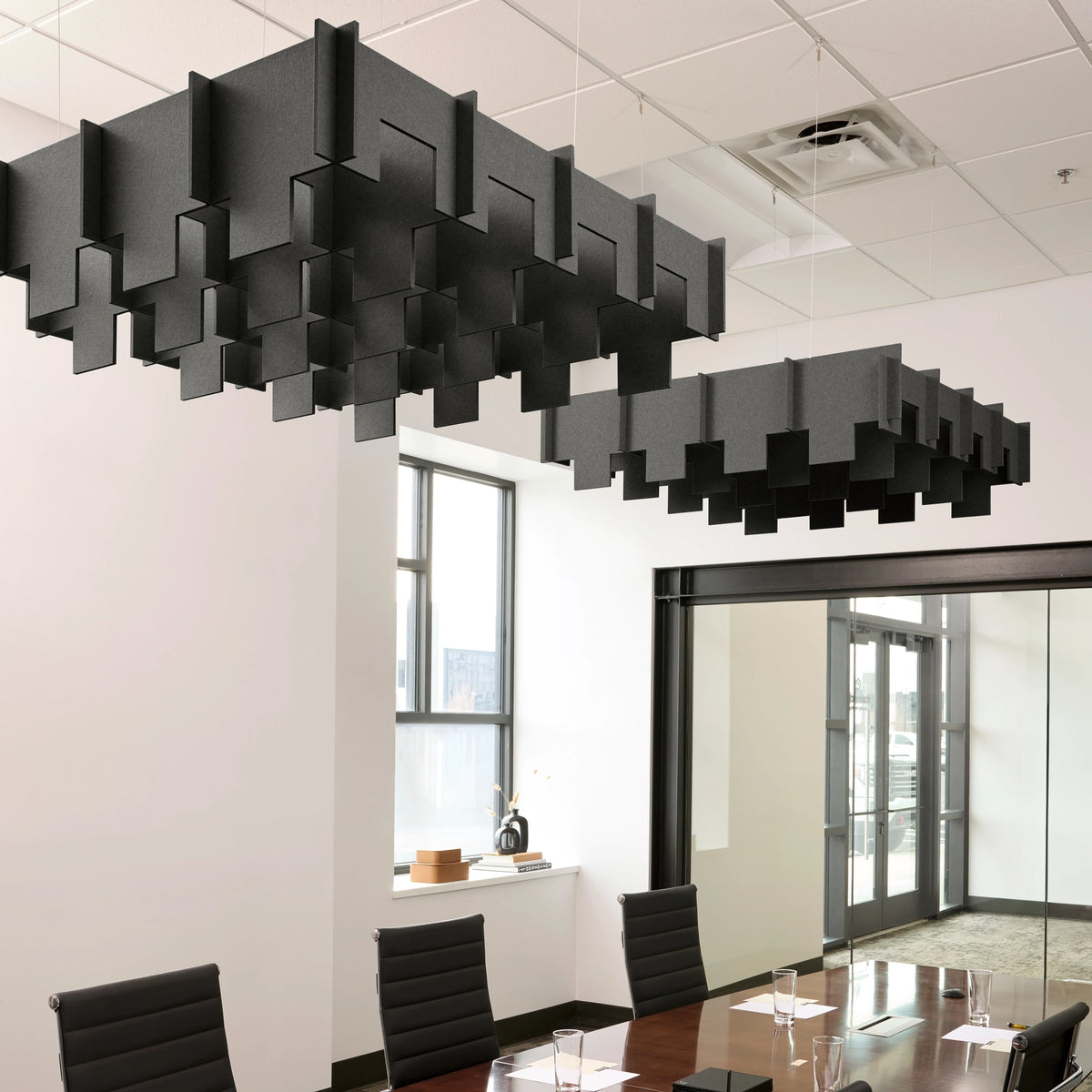 Drop 3D Cloud acoustic ceiling baffles in Cast felt above a conference table