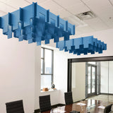 Drop 3D Cloud acoustic ceiling baffles in Cayman felt above a conference table