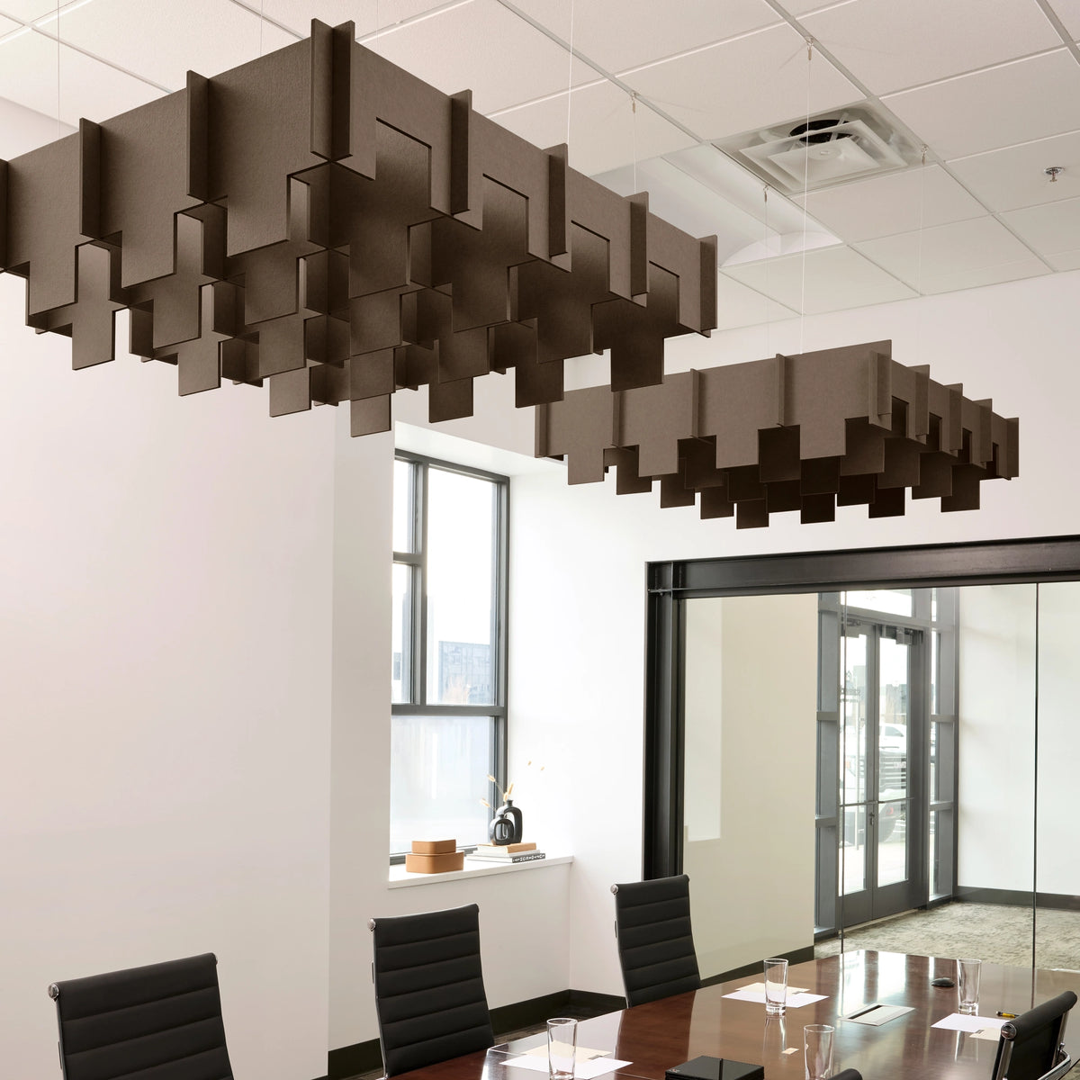 Drop 3D Cloud acoustic ceiling baffles in Cocoa felt above a conference table
