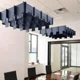 Drop 3D Cloud acoustic ceiling baffles in Indigo felt above a conference table