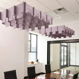 Drop 3D Cloud acoustic ceiling baffles in Lilac felt above a conference table