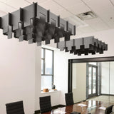 Drop 3D Cloud acoustic ceiling baffles in Mineral felt above a conference table