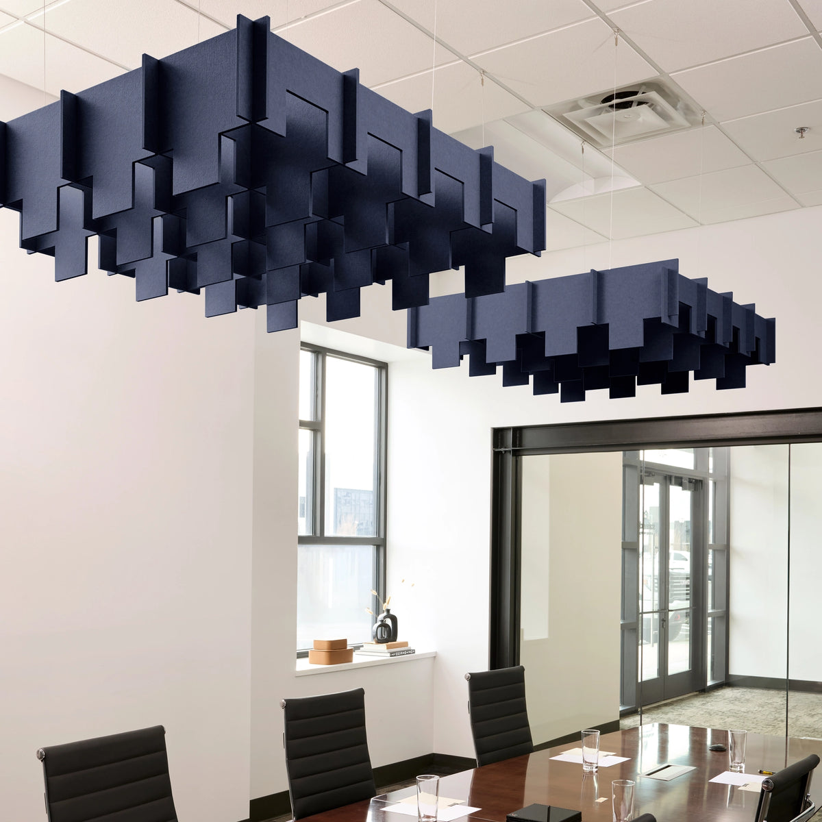 Drop 3D Cloud acoustic ceiling baffles in Oxford felt above a conference table