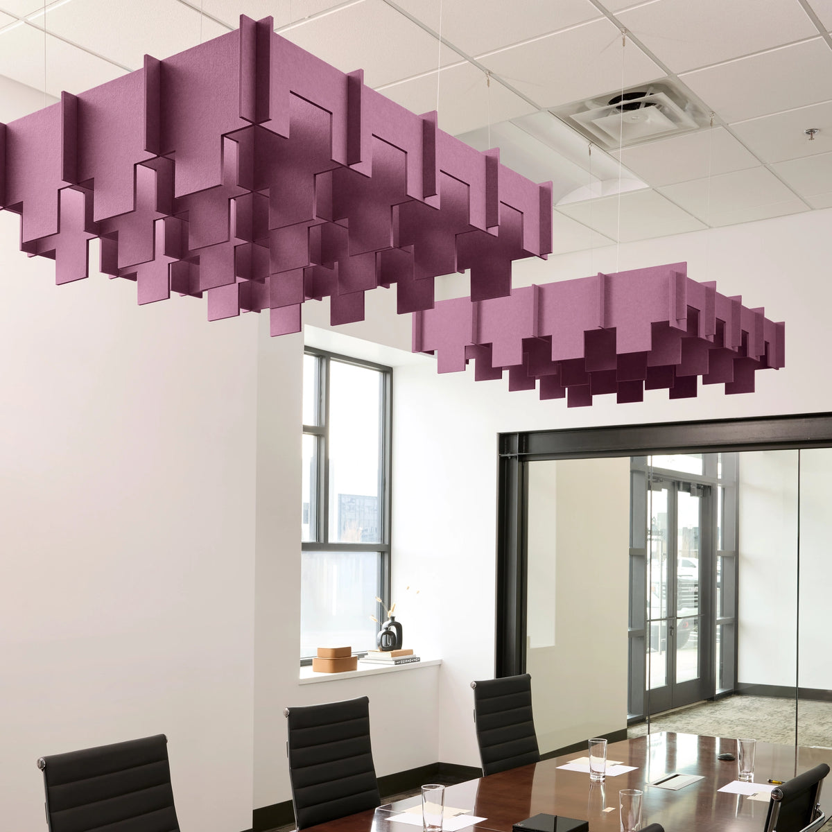 Drop 3D Cloud acoustic ceiling baffles in Plum felt above a conference table
