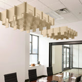 Drop 3D Cloud acoustic ceiling baffles in Porcelain felt above a conference table