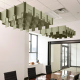 Drop 3D Cloud acoustic ceiling baffles in Sage felt above a conference table