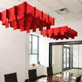 Drop 3D Cloud acoustic ceiling baffles in Scarlet felt above a conference table