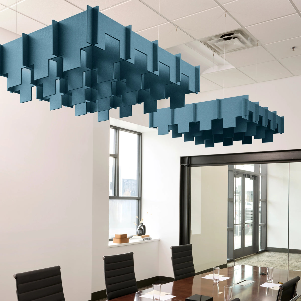 Drop 3D Cloud acoustic ceiling baffles in Slate Blue felt above a conference table