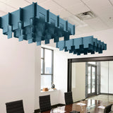 Drop 3D Cloud acoustic ceiling baffles in Slate Blue felt above a conference table