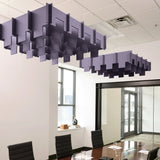 Drop 3D Cloud acoustic ceiling baffles in Wisteria felt above a conference table
