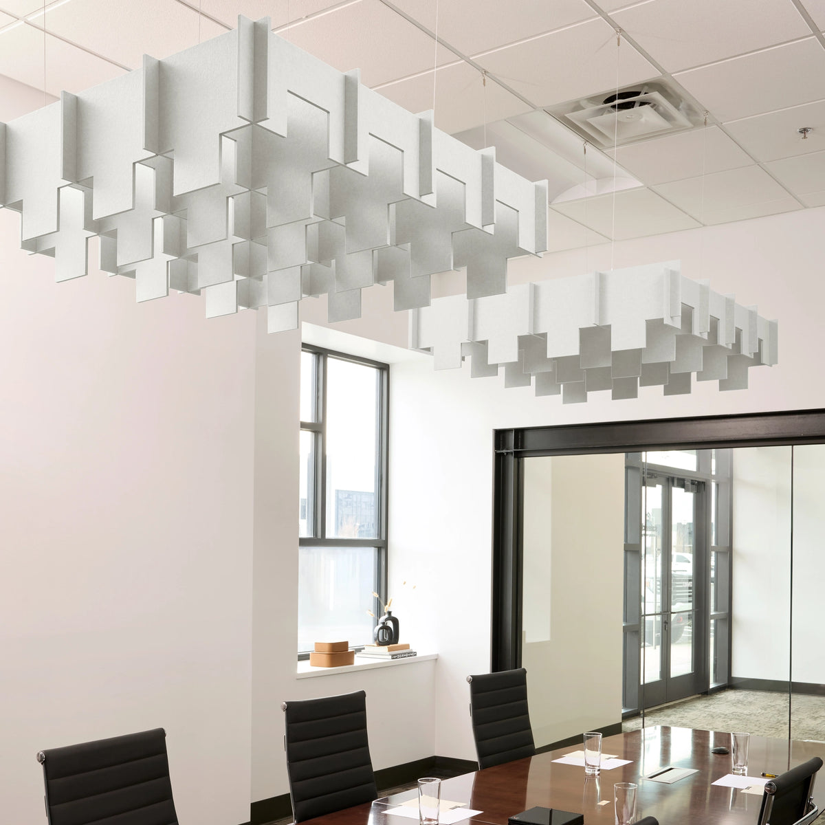 Drop 3D Cloud acoustic ceiling baffles in Zinc felt above a conference table