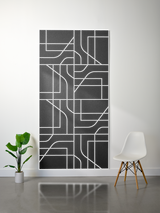 Charcoal gray felt sheet with white engraved subway map pattern of intersecting lines and rectangular sections.
