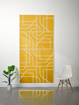 Gold and white layered felt sheet with engraved subway map design mounted on wall.