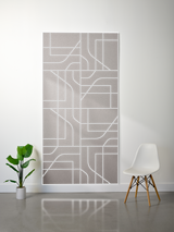 Gray felt sheet with white engraved subway map pattern and layered geometric design.