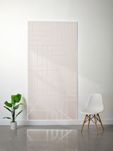 Beige felt sheet with engraved subway map lines in grid pattern and curved routes.